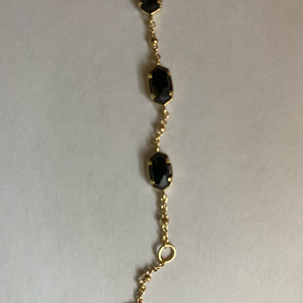 Kendra Scott black and gold dainty bracelet.